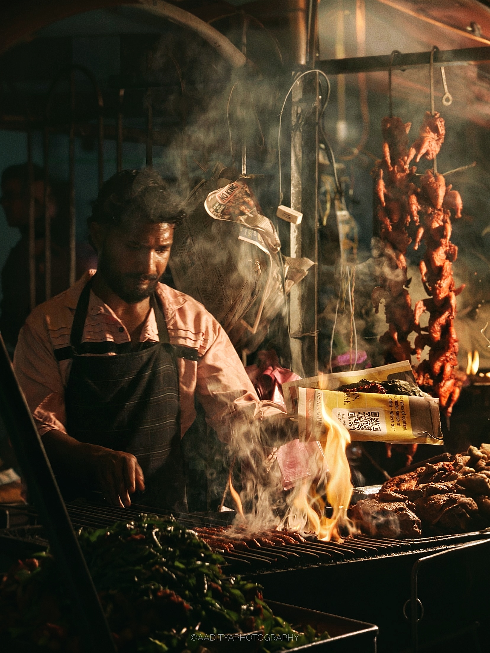 A street barbeque seller doing live cooking