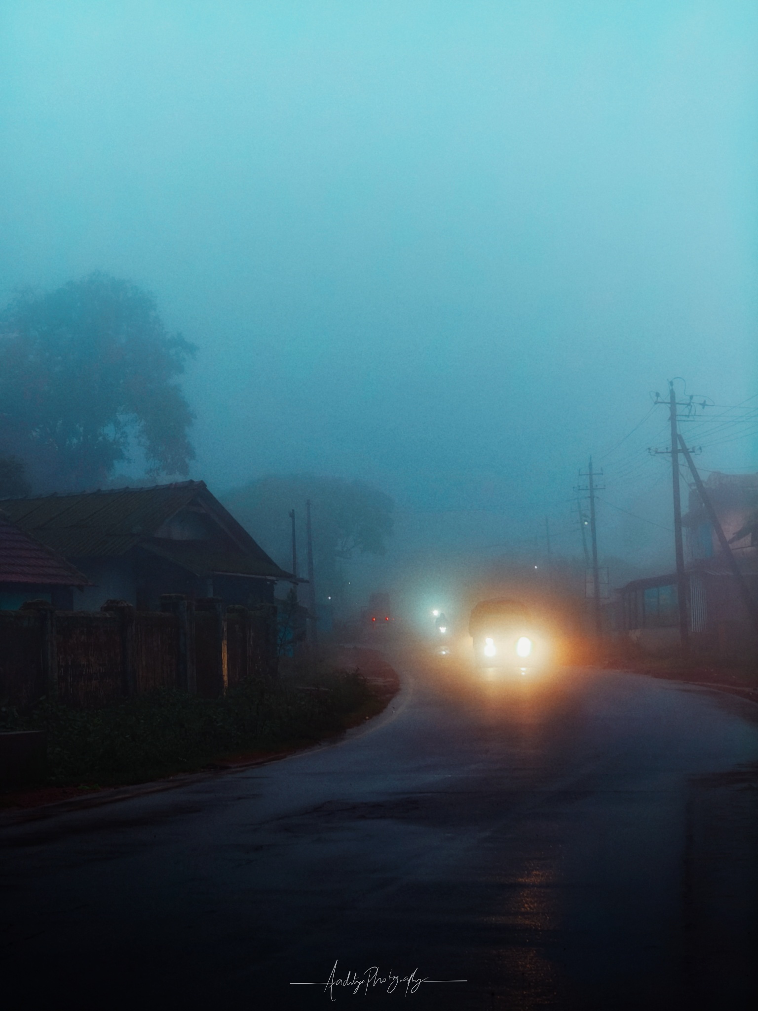 A van coming throught the mist